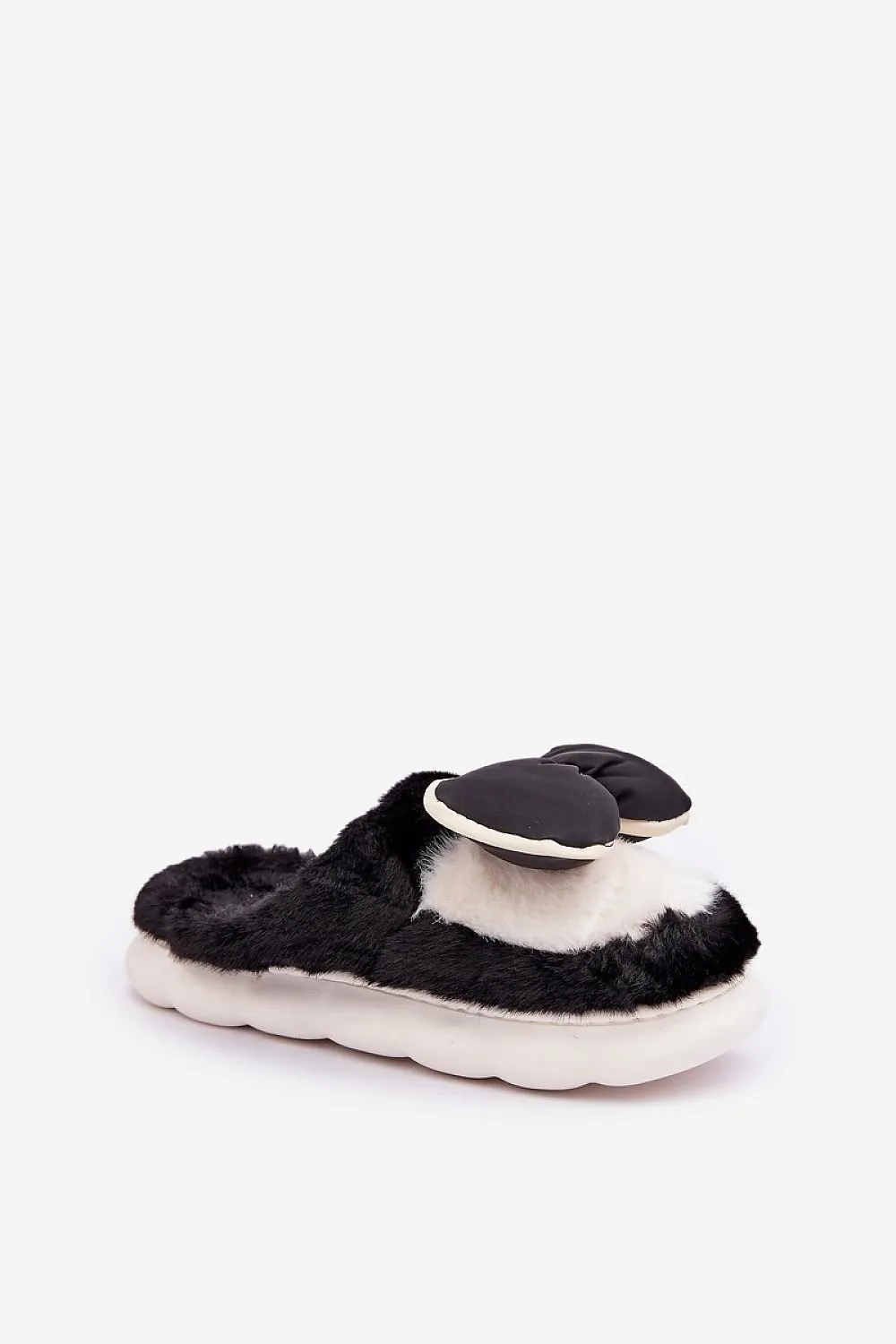 Soft cozy fur slippers decorated with a bow