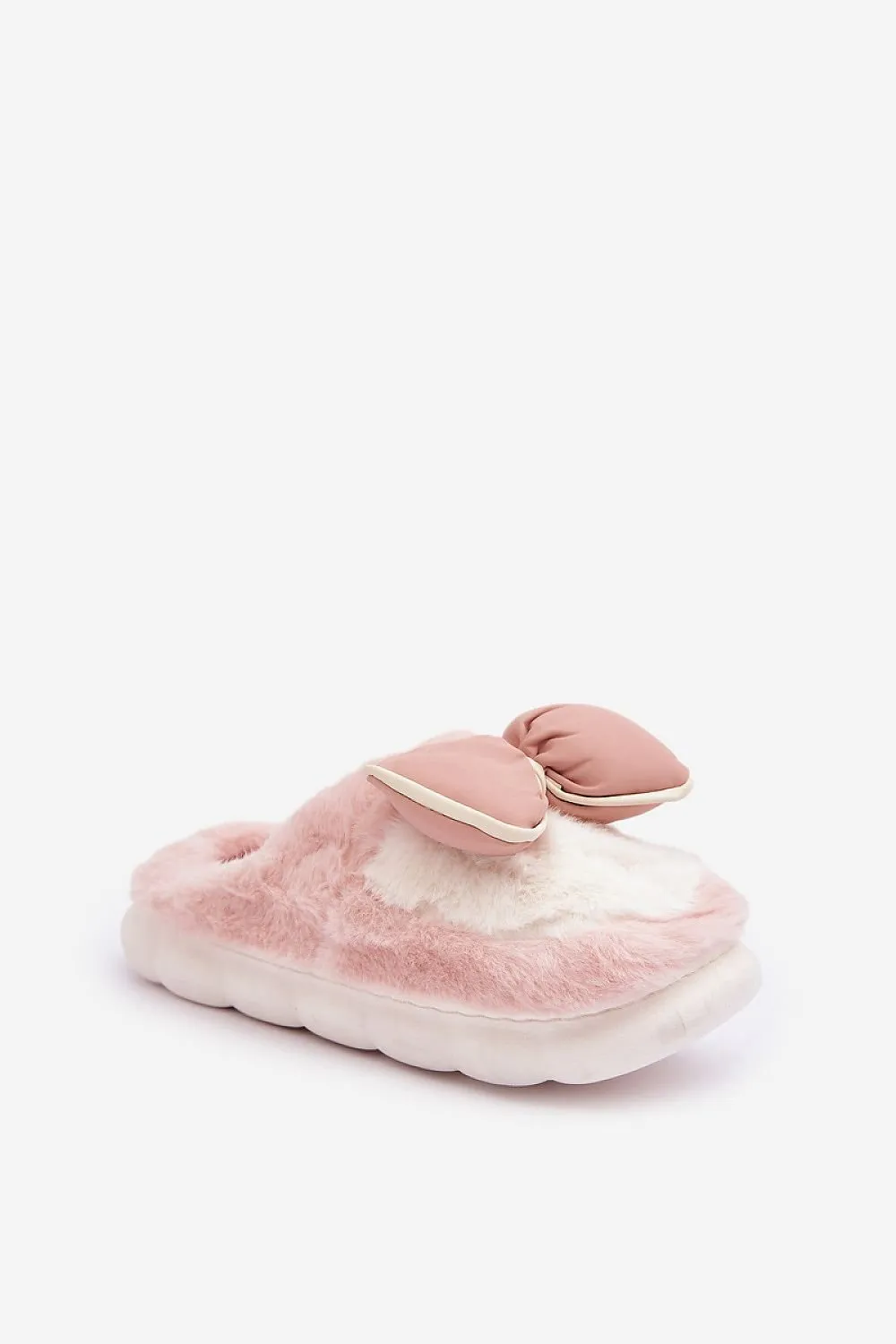 Soft cozy fur slippers decorated with a bow